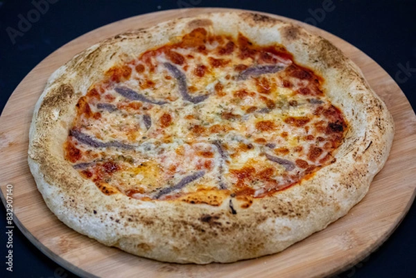 Fototapeta Traditional alicci or anchovy pizza, isolated in selective focus