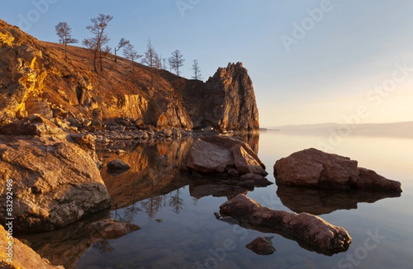 Fototapeta Lake Baikal. Bright colors of spring sunset on coastal cliffs