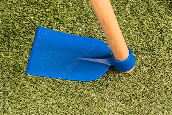 Obraz Blue hoe on artificial grass