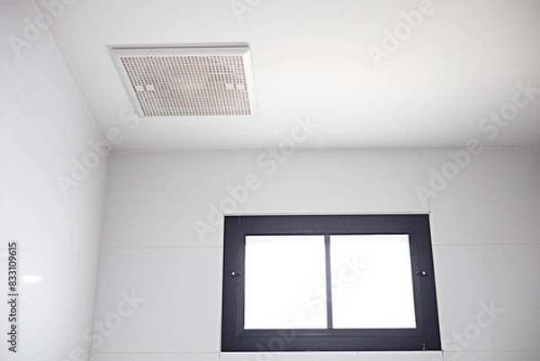 Fototapeta The exhaust fan is installed on the ceiling near the skylight.