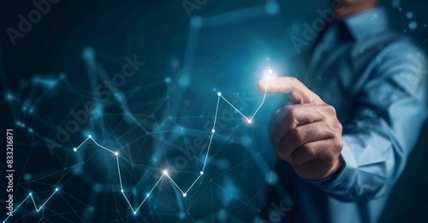 Fototapeta Businessmen touch the glowing arrow line chart of business growth and success, stock concept. The background shows business growth and success,