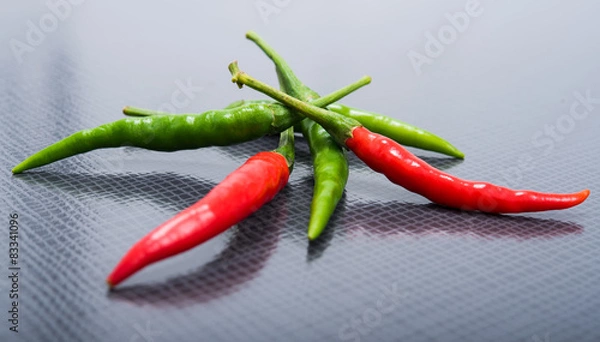 Obraz chili pepper on a black texture