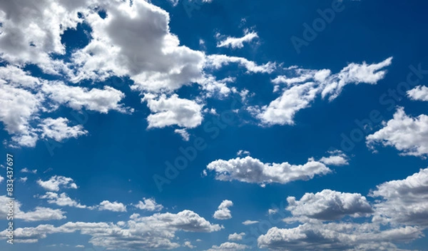 Obraz Fluffy cumulus clouds on blue sky background. Cloudscape