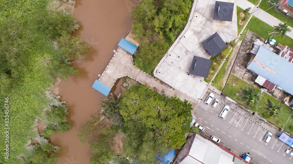 Fototapeta drone view from above the river and town
