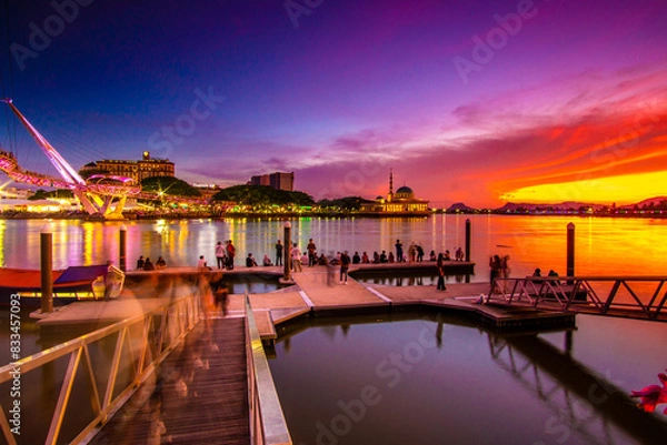 Fototapeta the view of the river and pier at dusk which is red which attracts visitors to the pier