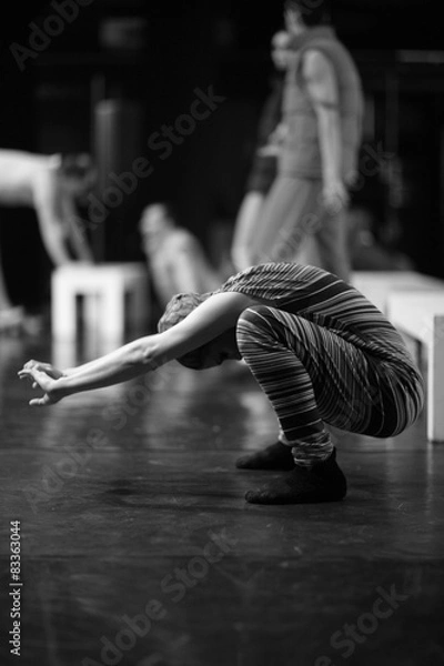 Fototapeta A dancer warming up before a performance