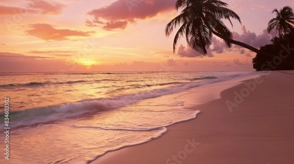Fototapeta A tranquil beach scene at sunrise with golden sand, gentle waves lapping at the shore, and palm trees swaying in the breeze. The sky is painted with shades of pink, orange, and purple as the sun