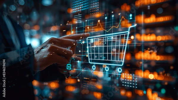 Fototapeta Sales growth concept. Businessman touches a graph of increased sales volume with a shopping cart on a virtual screen to promote ecommerce expansion. 