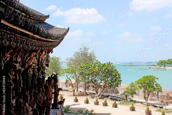 Fototapeta Lovely ocean view from a temple with wooden architecture by the coast, Sanctuary Of Truth, Pattaya, Thailand