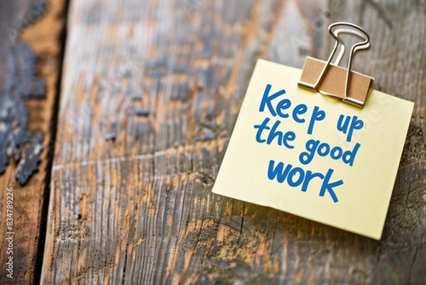 Fototapeta  Motivational Note Saying "Keep Up The Good Work" Attached to Wooden Surface