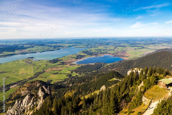 Fototapeta Green fields next to Neuschwanstein