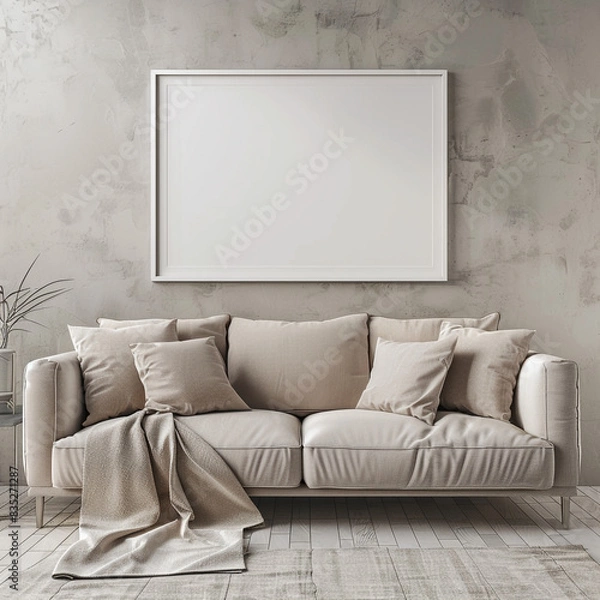 Fototapeta A modern living room featuring a chic taupe sofa and an empty white frame on the wall, blending style with simplicity.