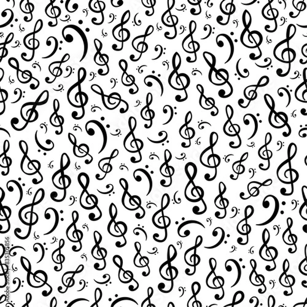 Fototapeta Hand-drawn treble and bass clef musical symbols arranged in vector seamless pattern. Surface art texture in black and white for use in fabric or graphic design or printing on various surfaces.