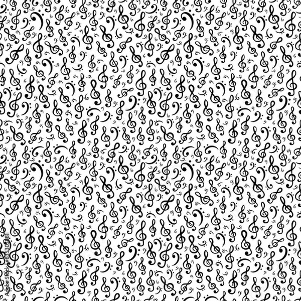 Fototapeta Hand-drawn treble and bass clef musical symbols arranged in seamless pattern. Surface art texture in black and white for use in fabric or graphic design or printing on various surfaces.