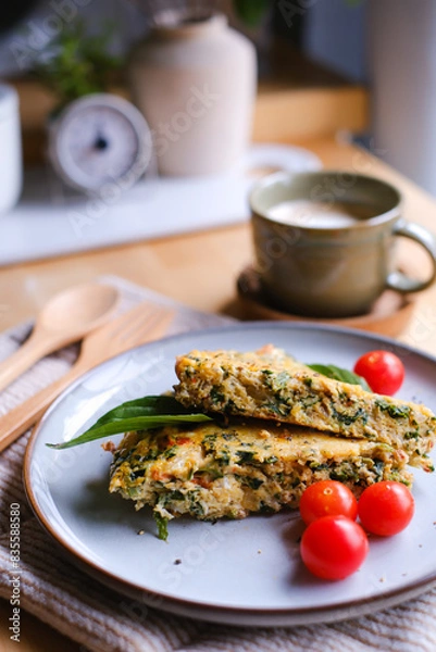 Fototapeta A healthy low-carb or ketogenic breakfast is on the table. Baked omelet or frittata for a delicious meal.