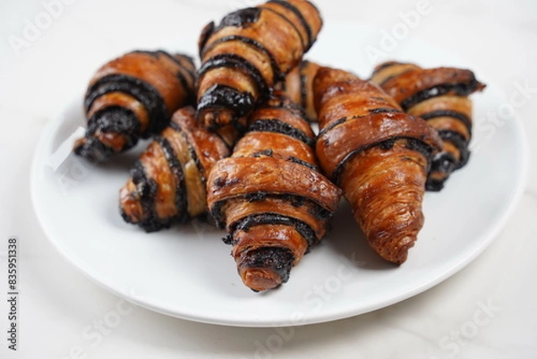 Fototapeta Delicious fresh baked Rugelach with chocolate filling on plate