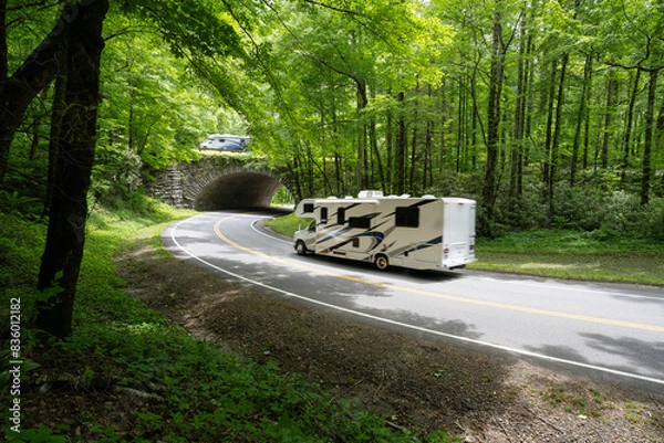 Fototapeta Recreation vehicles driving over and below an overpass along a mountain road through a forest, The Loop, Newfound Gap Road, Great Smoky Mountain National Park, Tennessee