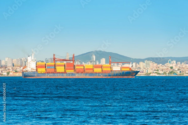 Obraz Container ship, cargo ship with many containers entering harbor port