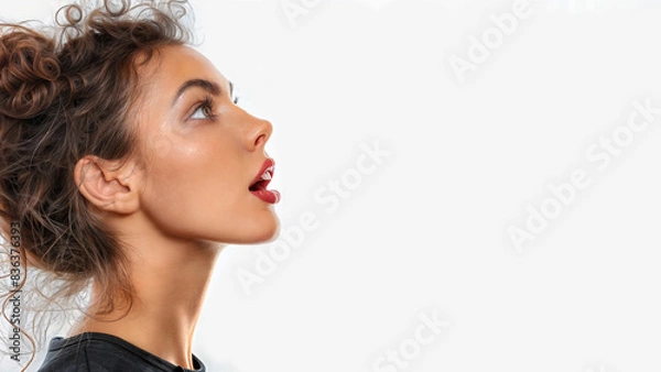 Fototapeta Close up profile of a young latino woman with mouth open wide, shouting. Isolated on white, copy space, aspect ratio 16:9