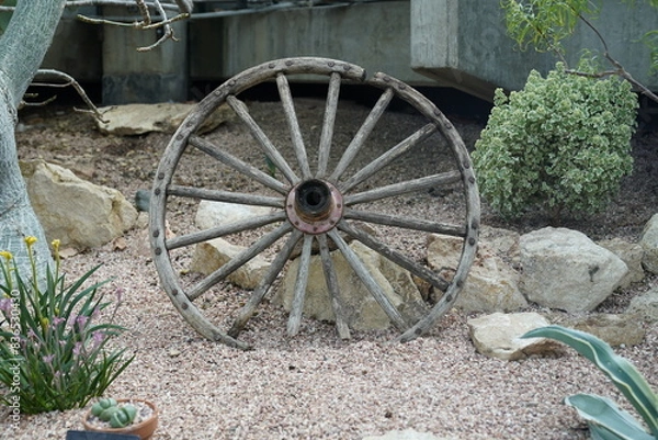Obraz Wooden wheels in the sand