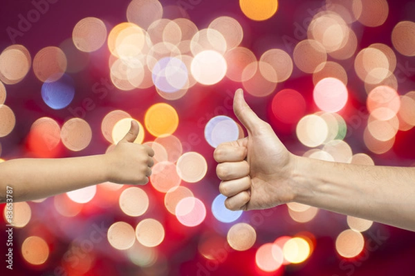 Fototapeta father and son hands giving like on christmas lights background