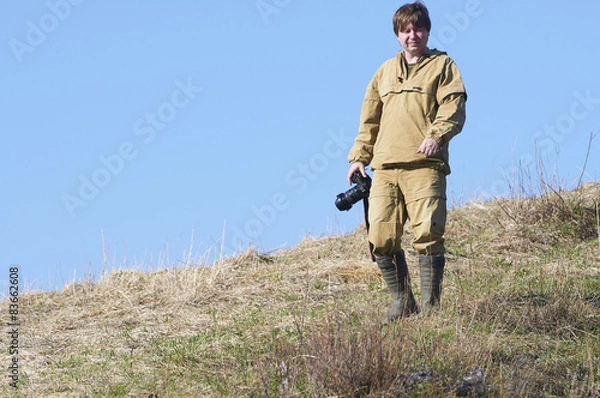 Fototapeta Scientists photographer standing on top of a hill in Altai