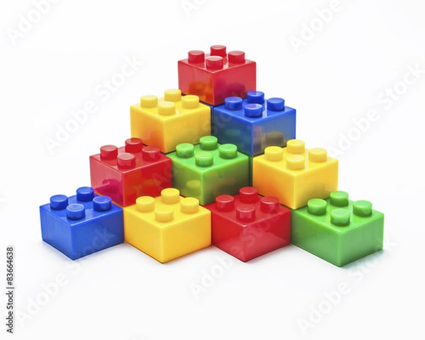 Fototapeta Colorful stacked toy building blocks.