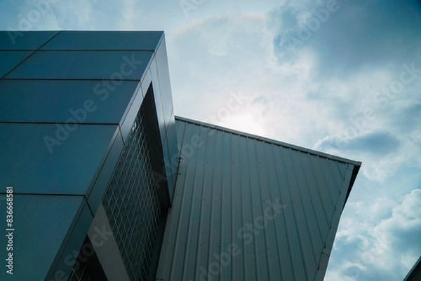 Fototapeta A building with a roof that has a rainbow on it