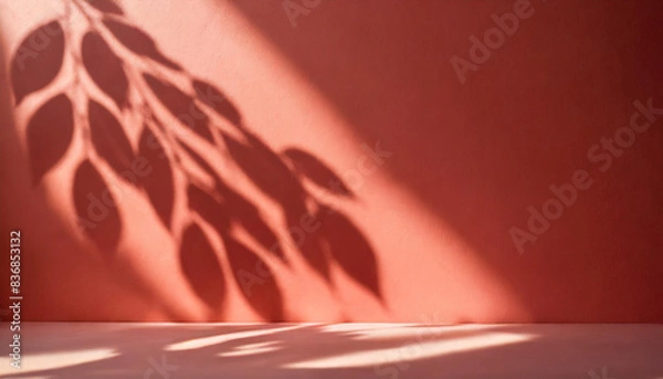Fototapeta light background of shadows from plant leaves on a delicate light red wall, minimalistic background for the presentation of your products, stock wallpaper image template