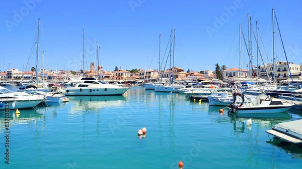 Fototapeta Photo of a wide range of yachts of various sizes docked at Aegina Marina in Greece.