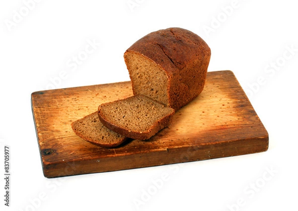 Obraz Нарезанный хлеб на деревянной доске 