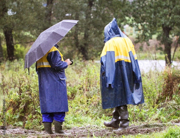 Obraz Working going to rain on a muddy road