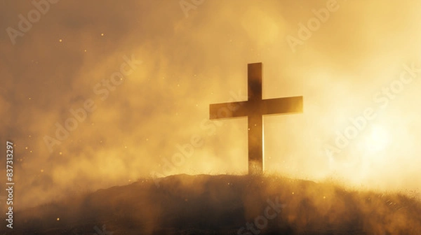 Obraz A Christian cross on a remote hill during a foggy sunrise, with the light diffusing through the fog to form a soft golden bokeh, enveloping the cross in a light that suggests the dawn of hope.