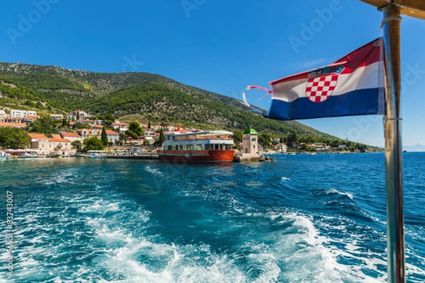 Fototapeta Croatian Bol city on Brac island view from sea .
