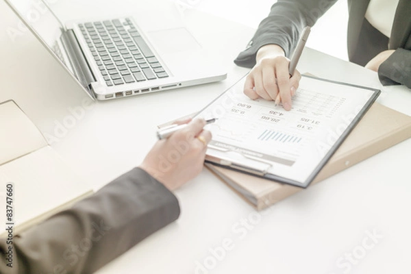 Fototapeta Business people discussing the charts and graphs showing the res