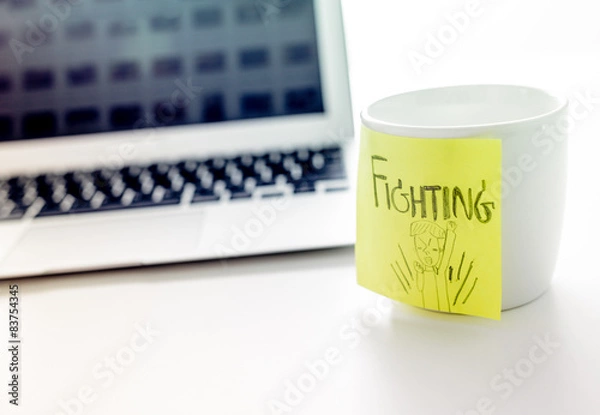 Fototapeta Note and post-it on cup of coffee with laptop