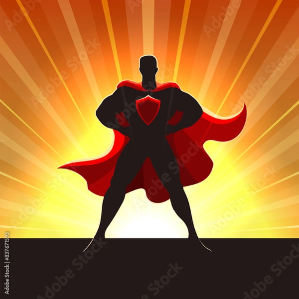 Fototapeta Superhero Silhouette in Red Cape Standing in Rays of Light