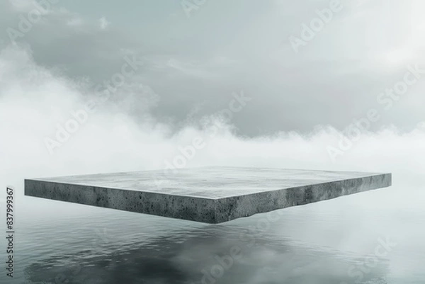 Fototapeta A floating concrete slab hovers over a calm reflective water surface amidst a serene and misty environment, creating a surreal and minimalist scene.