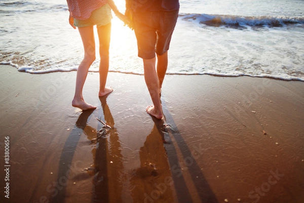 Obraz Young couple walking on the beach