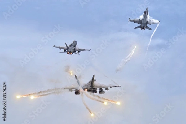 Fototapeta Jet fighters firing chaff flare during training