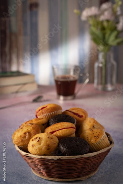 Obraz muffins with coffee and some flowers