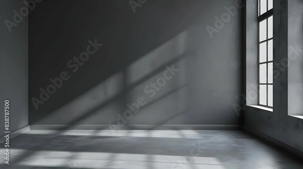Fototapeta Minimalistic empty room with large windows casting shadows on the wall and floor, creating a serene and tranquil atmosphere.