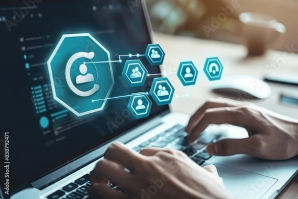 Obraz A business person uses a laptop to create target audience ICONS,Digital marketing online, CRM, Data exchanges development and customer service.