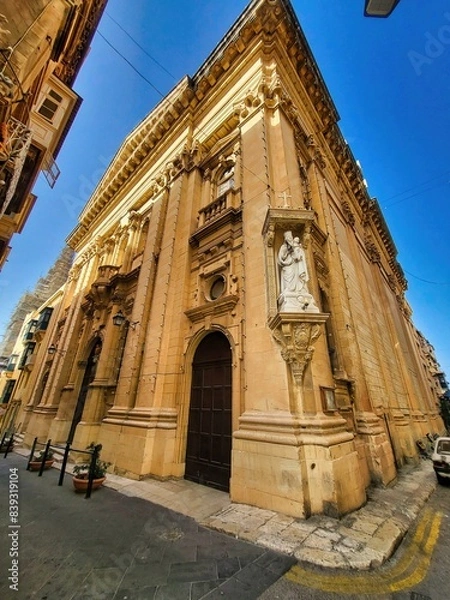 Obraz Brick wall old house. La vieille charite, almshouse, ancient building with column. The ruins of the ancient city. Religious background. Travel concept. Tourist attraction. Close up. Arkadi aspect