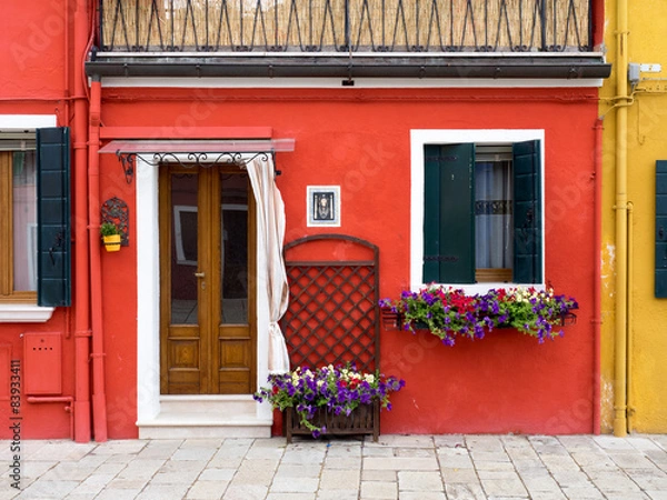 Obraz Burano, Italy - Red painted building. One of the ma
