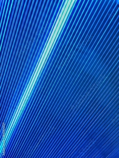 Fototapeta Bright intersecting rays of light of different colors. Fractal image of blue concentric ripples for a background. Directional motion blurred background or backdrop. Metal sheet background