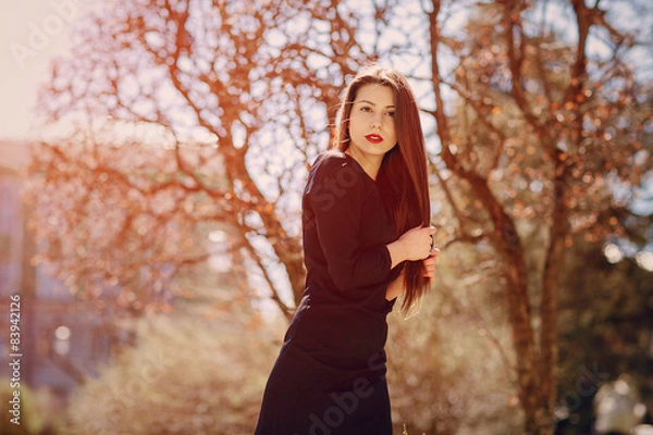 Fototapeta Beautiful brunette poses for photos