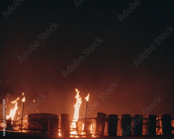 Obraz Out of focus background with fire behind fence on night background. Generative AI