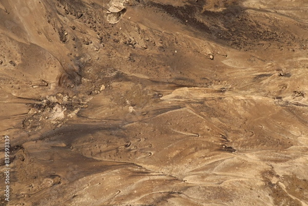 Fototapeta  Background close-up a sandy surface.   Soil is washed away by the rain