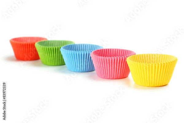 Fototapeta Empty colorful cupcake cases isolated on white